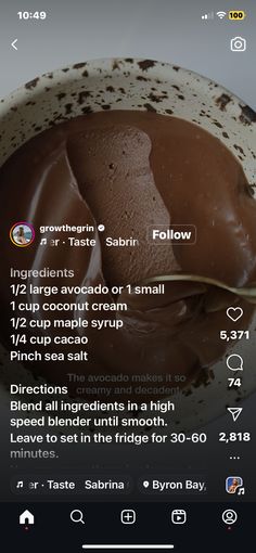 a bowl filled with chocolate pudding on top of a table