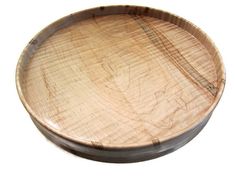 a wooden bowl with metal handles on a white background