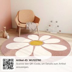 a living room with a chair and flower rug