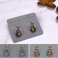 Cute and dainty omnisexual pride earrings in two shades of pink, dark purple and two shades of blue to best match the omni pride flag. These comfortable tiny earrings are a great way to subtly and discreetly express your pride! 🩷 lightweight aluminum links on durable stainless steel ear post💜 earrings measure 0.5" long from top of stud💙 extra ear backs included (extras may be different style) 🌈 Also in the shop: View all tiny hoop pride stud earrings Pride Earrings, Genderfluid Pride, Lesbian Pride Flag, Pride Jewellery, Asexual Pride, Pride Colors, Pansexual Pride, Tiny Earrings, Steel Post