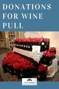 donations for wine pull are stacked on top of each other in black boxes with red roses