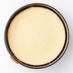 an overhead view of a pan filled with food on top of a white countertop