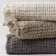 three blankets stacked on top of each other