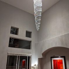 a chandelier hanging from the ceiling in a living room