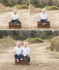 two baby boys sitting on top of a wooden crate in the middle of a field