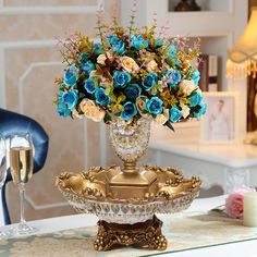 a vase filled with flowers sitting on top of a table