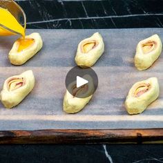 an image of food being made on a baking sheet with orange juice in the background