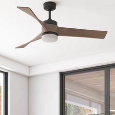 a ceiling fan in a room with sliding glass doors