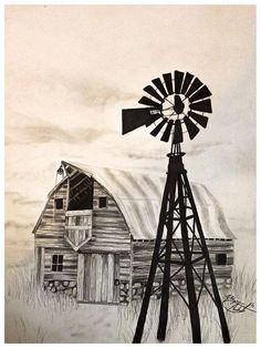 a black and white photo of a windmill in front of a building with a barn