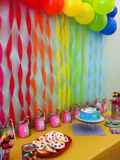 an image of a birthday party with balloons and desserts on the table in front of it