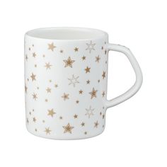 a white coffee cup with gold stars on the outside and inside, sitting in front of a white background