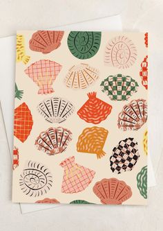 A blank card with illustrations of checker print shells. Cards To Sell, Punch Card Design, Envelope Sizes, Gifts Cards, Card Patterns, Punch Cards, Sustainable Design, Place Cards, White Envelopes