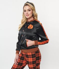 This scaretastic bomber style jacket is crafted in a black and orange satin-like fabric. Outfitted with a snap button up front, long sleeves, side pockets, and a large screen print on the back with the words, ‘Scream Queen'. Complete with a spooky pumpkin embroidered on the chest.Available in sizes XS-5X while supplies last. Black Halloween Outerwear, Orange Track Jacket For Fall Streetwear, Orange Long Sleeve Track Jacket For Fall, Long Sleeve Orange Track Jacket For Fall, Retro Black Track Jacket For Fall, Halloween Jacket, Uv Clothing, 2024 Wishlist, Classic Halloween