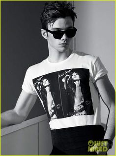 a young man wearing sunglasses and a t - shirt