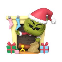 the grinch is coming out of the fireplace with his christmas hat and stockings on