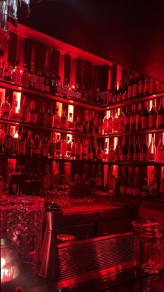 a room filled with lots of bottles and glasses