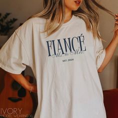 Our classy fiancè shirt is the perfect addition to your engagement personalized with your wedding year! Gift to a friend or sister you know that is newly engaged!  **UNISEX T-SHIRTS- Run true to size. If wanting a more oversized look, selecting 1 or 2 sizes up is recommended. **CUSTOMIZATION-If you would like this design in a different color or on a different item (t-shirt, sweatshirt, tank top, bag, hat, etc.)-please message us and we will do our very best to get it made for you. Placing an ord Engagement Shirt Ideas, Ms To Mrs, Etsy Pod, Engagement Shirts, Engagement Shirt, Engaged Af, Wedding Shirt, Engaged Shirts, Just Engaged