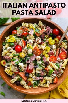 a bowl filled with pasta salad on top of a table