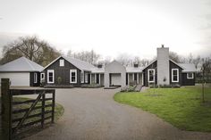 a large house with lots of windows in the front yard