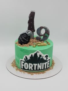 a cake that has been decorated to look like a fortnite themed birthday cake