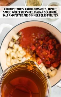 a pot filled with sauce next to other ingredients