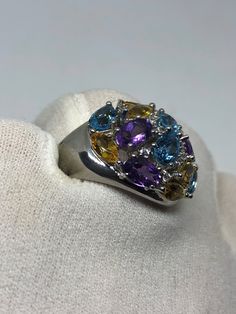 Huge great color blue topaz amethyst citrine and white sapphires stone setting is handcrafted in 925 sterling silver Can be sized, my jeweler charges $10. All rings are shipped in a nice gift box. Check out our over a THOUSAND great reviews Engraving is $4 per letter and is not always perfect depending on the piece. It can take a few days if the jeweler is busy. This is payable to Paypal Judithsltd@gmail.com Multicolor Oval Amethyst Ring With Accent Stones, Multicolor Amethyst Rings With Accent Stones, Oval Multi-stone Topaz Gemstones, Silver Multi-stone Diamond Gemstones, Fine Jewelry Topaz Gemstones With Gemstone Accents, Sterling Silver Multi-stone Topaz Ring, Fine Jewelry Gemstones With Topaz Accents, Luxury Multi-stone Blue Topaz Gemstones, Topaz Gemstones With Gemstone Accents