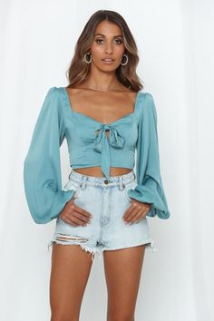 Length from shoulder to hem of size S: 39cm.Aqua crop top. Lined.Cold hand wash only. Model is a standard XS and is wearing a size XS. True to size. Lightweight, non-stretchy woven satin with sheen.Tie-up neckline.Invisible side zipper.Shirred, stretchy back. Polyester. Uh, we want it! We're getting flamenco dancer and gypsy vibes from the Lipstick Kisses Through The Phone Crop! This add to card ASAP style features a cute tie-up keyhole bust offset by breezy bishop sleeps. This crop top comes wi Flamenco Dancer, Bodycon Dress Formal, Lipstick Kiss, Red Slip Dress, Party Rompers, Flamenco Dancers, Long Sleeve Dress Formal, Midi Dress Party, Cropped Tops