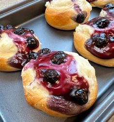 blueberry danish rolls on a baking sheet ready to be baked