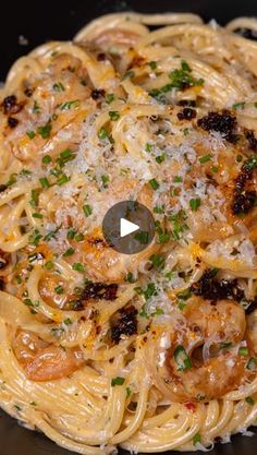 pasta with shrimp and parmesan cheese in a skillet