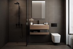 a bathroom with a toilet, sink and shower in it's center wall area