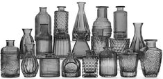 an assortment of glass vases are shown in black and white