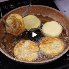 some food is being cooked in a pan on the stove