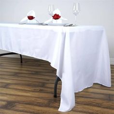 the table is set with two glasses on it