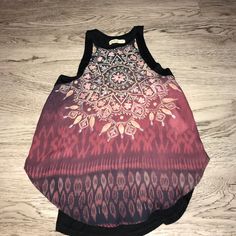 This Has Never Been Worn And Is New Without Tags. The Front Is A Maroon Color With Pink, Green, Blue, And Yellow Patterning. The Back Is Just Black. Be Sure To Check Out All My Other Listings! I Accept Reasonable Offers. Thanks For Viewing My Item! Casual Red Festival Tank Top, Bohemian Black Tank Top, Chic Red Tops For Festival, Just Black, Hollister Tops, Maroon Color, Blue And Yellow, Hollister, Black And Red