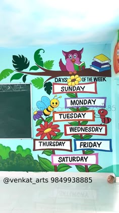 there is a mural on the wall of this school room that says days of the week