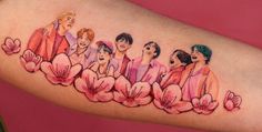 a woman's arm with an image of women in pink flowers on the side