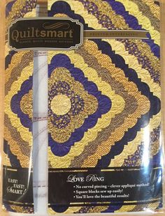 the quiltsmart pattern is shown in purple, yellow and gold