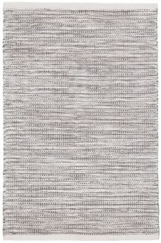 a gray and white rug with lines on it