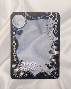 a card with an image of the moon and stars on it that says, moon child