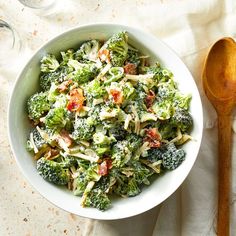 a white bowl filled with broccoli and bacon