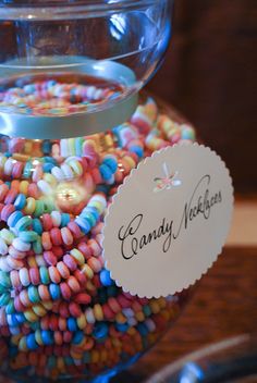 a glass jar filled with colorful candy beans