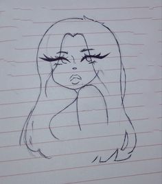 a drawing of a woman's face on lined paper