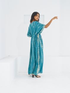 Switch to vacay mode anytime with the Goddess - Tie Dye Kaftan Maxi Dress. This undeniably sexy, breezy maxi dress will have you dreaming of the wind in your hair, the sound of the ocean waves, and the sand under your feet. Experience blissful comfort and breathability whether you’re at home or on vacay with the gorgeous flowy long dress and laid-back loose fit. Crafted in 100% soft, lightweight rayon, this dress features flawless tie-dye patterns and is perfect for tropical beachside vacations, Turquoise V-neck Maxi Dress For Vacation, Blue V-neck Maxi Dress For Poolside, Breezy Maxi Length Beach Cover-up Dress, Breezy Long Dress For Beach Cover-up, Turquoise Maxi Dress For Beach Cover-up In Spring, Breezy V-neck Maxi Dress For Poolside, Flowy Short Sleeve Maxi Dress In Breezy Style, Flowy Breezy Maxi Dress With Short Sleeves, Flowy Breezy Short Sleeve Maxi Dress