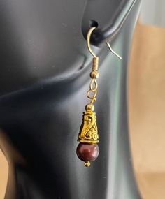 A little cultured freshwater pearl inside a cone shape gives these  earrings a unique appearance. Brown Pearl Drop Jewelry Gift, Brown Pearl Drop Jewelry For Gift, Teardrop Metal Pearl Earrings For Gift, Brown Pearl Drop Earrings As Gift, Brown Pearl Drop Earrings For Gift, Freshwater Pearls, Fresh Water, Jewelry Earrings Dangle, Dangle Drop Earrings