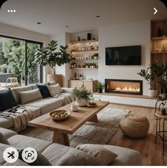 a living room filled with furniture and a fire place in the middle of it's wall