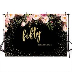 a black backdrop with pink flowers and gold foil lettering that says fifty fabulous on it