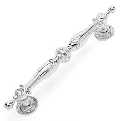 a silver bracelet with beads and charms on the end, in front of a white background