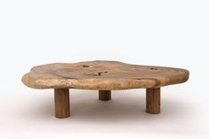 a wooden table that is made out of wood and has holes in the middle on it