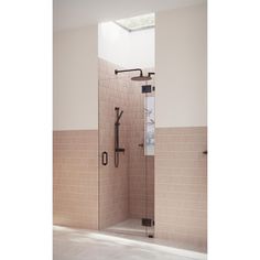 a walk in shower sitting inside of a bathroom next to tiled walls and flooring