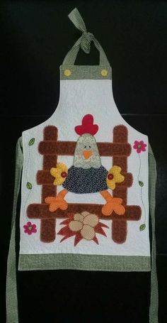 a white apron with an image of a chicken on it